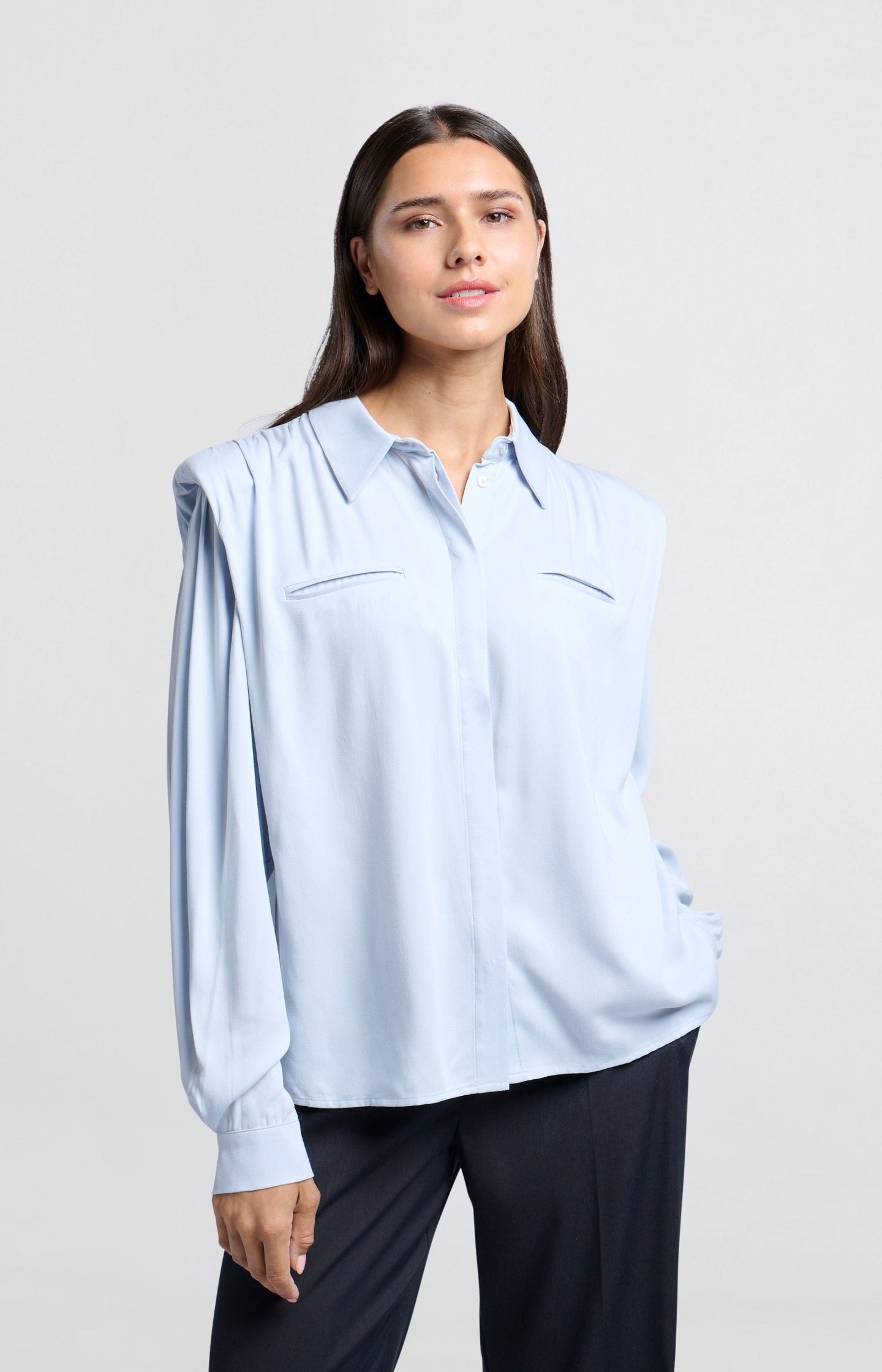 Blouse with long sleeves, buttons and shoulder pads