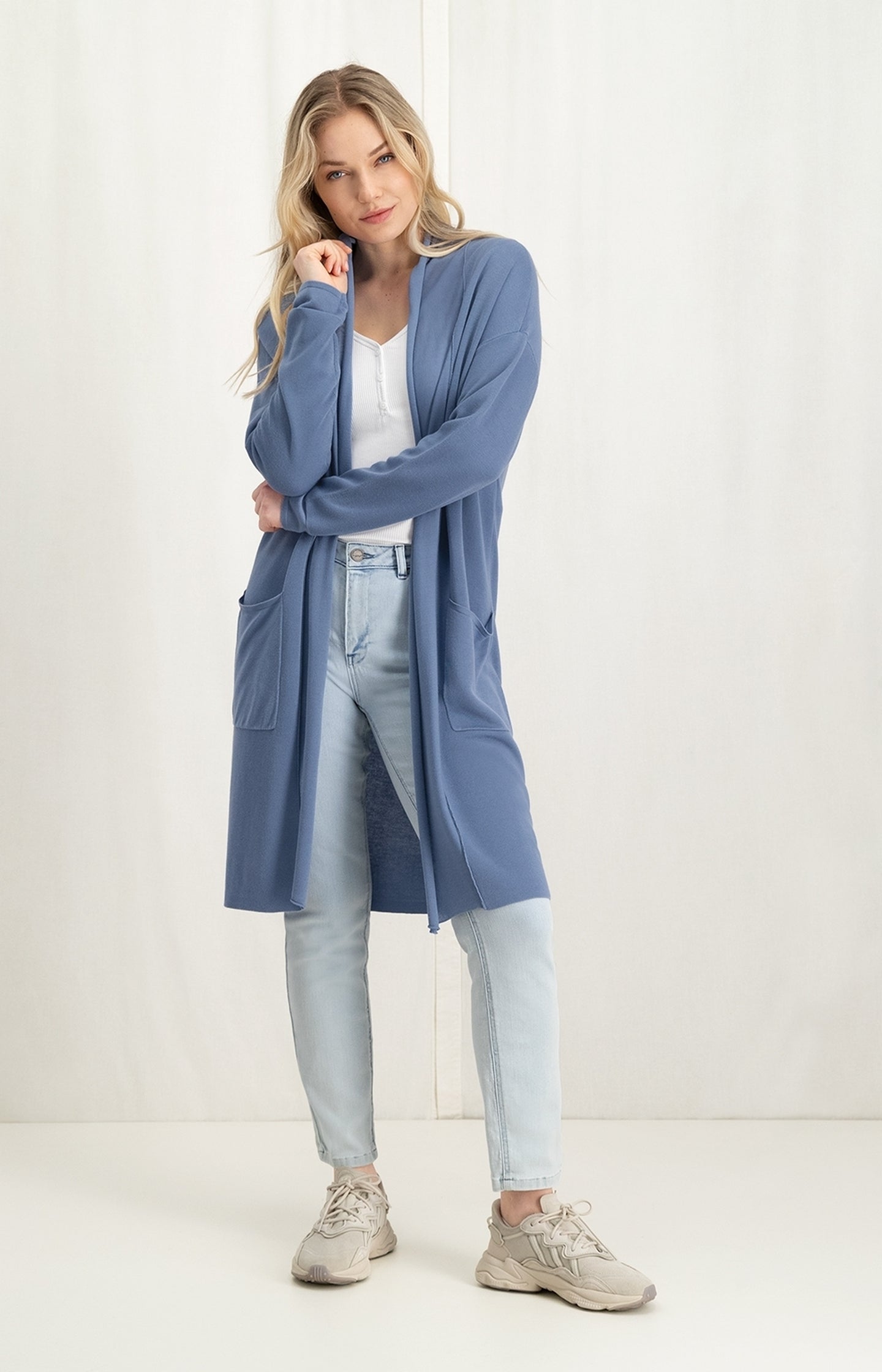 Long vest with long sleeves, dropped shoulders and pockets